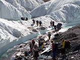 02 Crossing A Small River On The Upper Baltoro Glacier We intermixed with a Japanese Gasherbrum expedition to cross a small stream in a part of the Upper Baltoro Glacier where you realize that you are in fact trekking on a real glacier beneath the rubble.